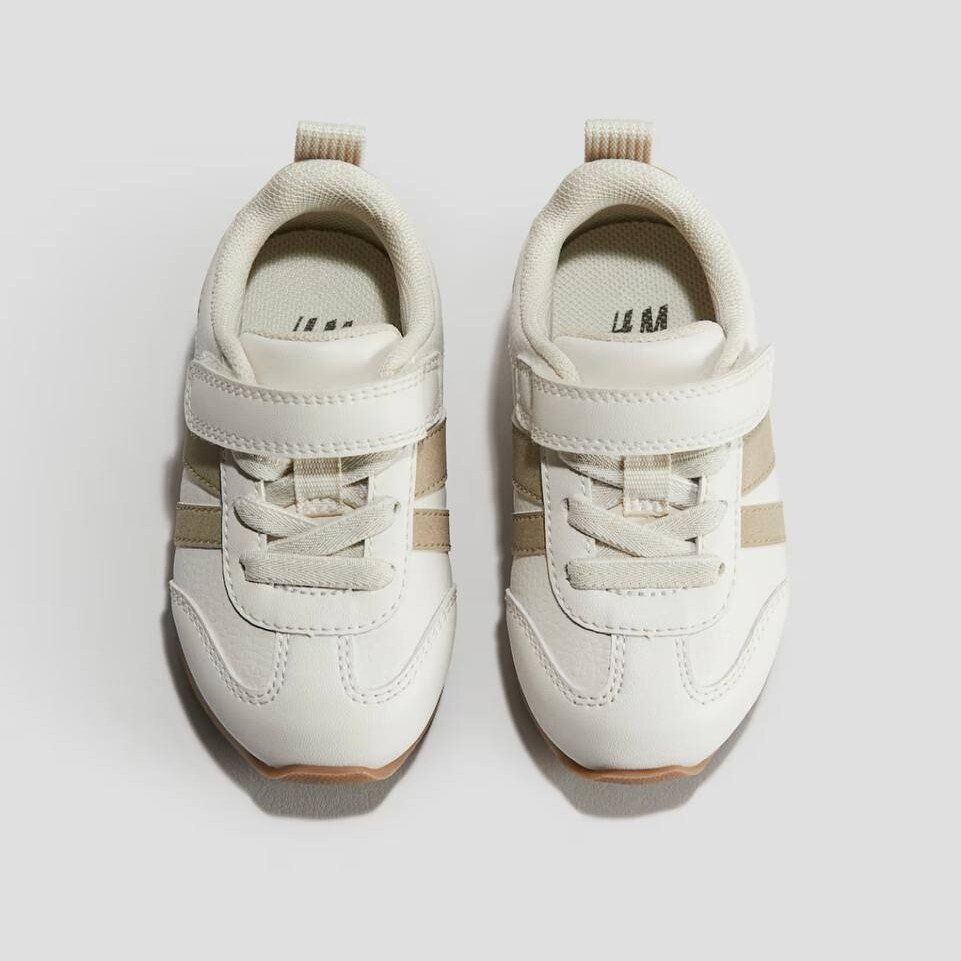 Кросівки H&M з екошкіри молочні з бежевими смужками