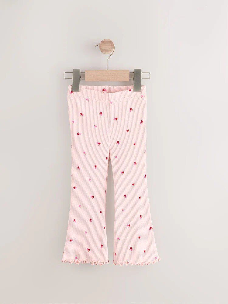 Рожеві легінси з кльошем та вишневими сердечками